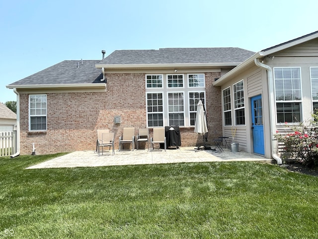5010 Cabrillo Dr, Plainfield, IN 46168 - rear view of property featuring a patio area, a lawn, brick siding, and roof with shingles