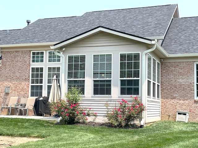 5010 Cabrillo Dr, Plainfield, IN 46168 - view of property exterior featuring brick siding, a shingled roof, and a yard