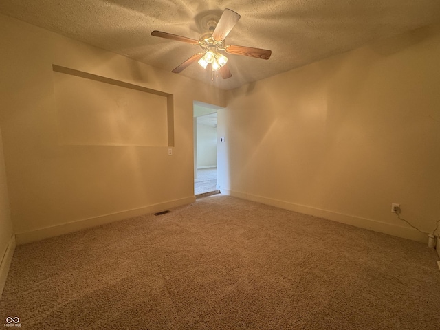 7929 Roy Rd, Indianapolis, IN 46219 - unfurnished room featuring a textured ceiling, light carpet, ceiling fan, and baseboards