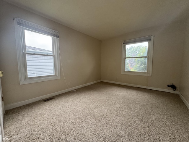 7929 Roy Rd, Indianapolis, IN 46219 - carpeted empty room with baseboards