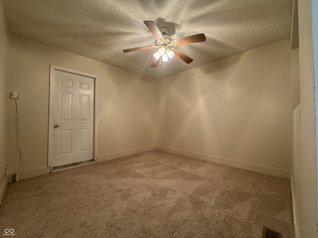 7929 Roy Rd, Indianapolis, IN 46219 - empty room with light colored carpet, a ceiling fan, a textured ceiling, and baseboards