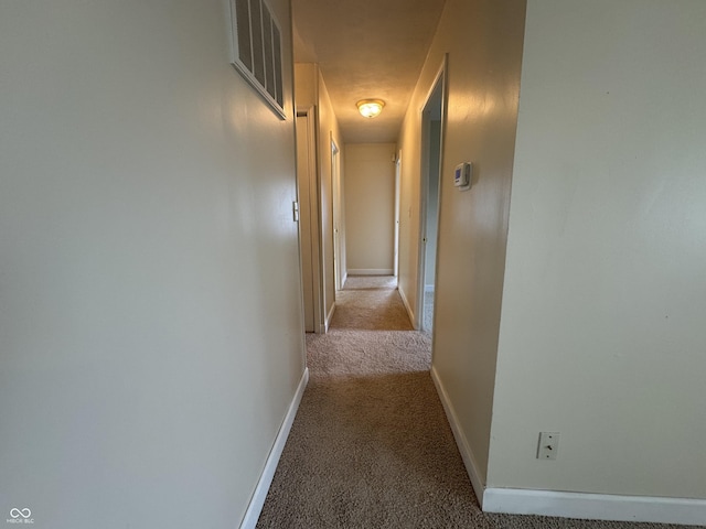 7929 Roy Rd, Indianapolis, IN 46219 - corridor with light carpet and baseboards