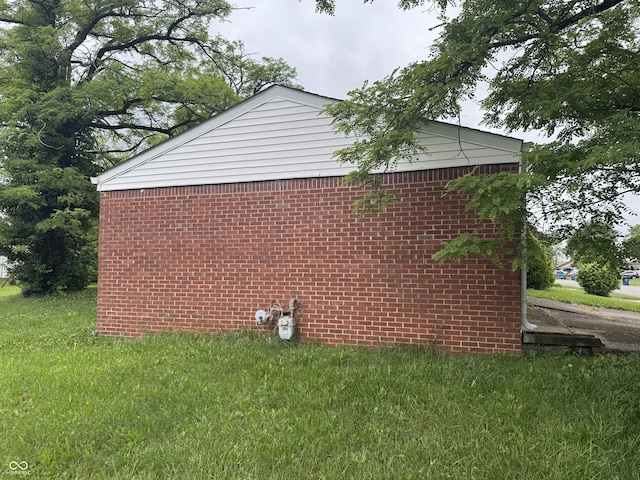 7929 Roy Rd, Indianapolis, IN 46219 - view of property exterior featuring brick siding and a lawn