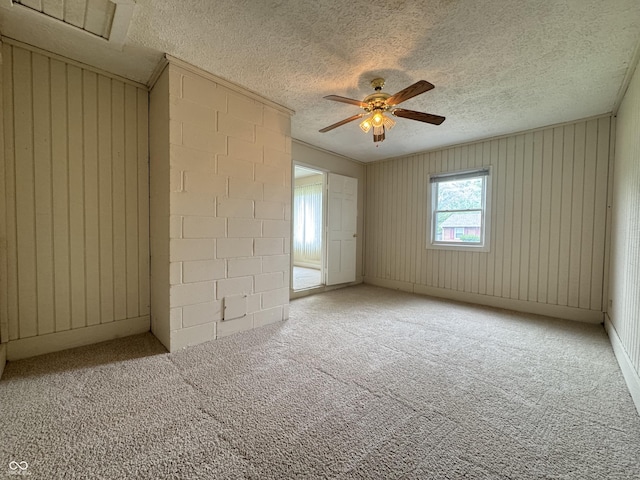 7929 Roy Rd, Indianapolis, IN 46219 - spare room with ceiling fan, carpet floors, and a textured ceiling