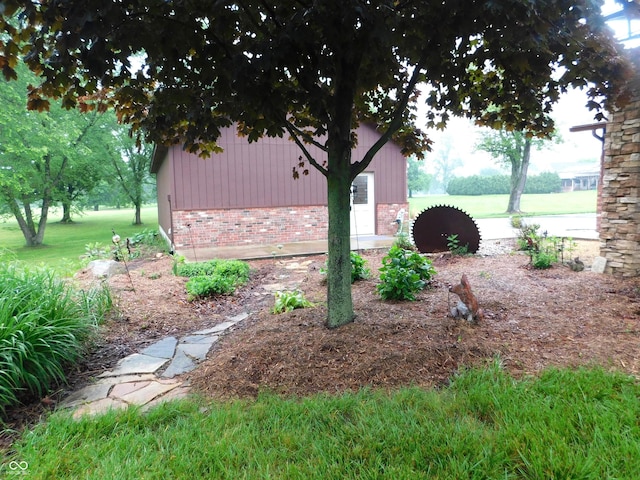 681 S County Road 150 W, Greensburg, IN 47240 - view of side of home with brick siding and a yard