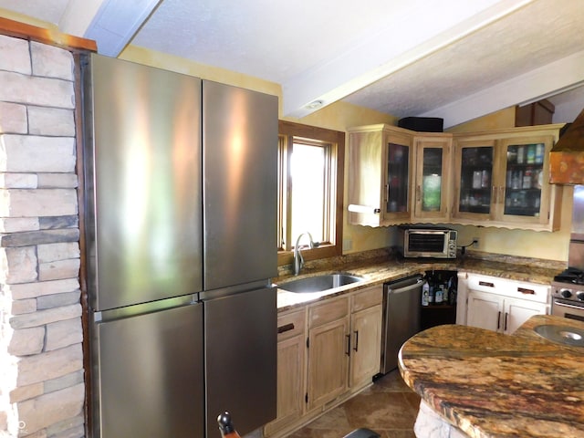 681 S County Road 150 W, Greensburg, IN 47240 - kitchen featuring a sink, stainless steel appliances, glass insert cabinets, dark stone countertops, and lofted ceiling