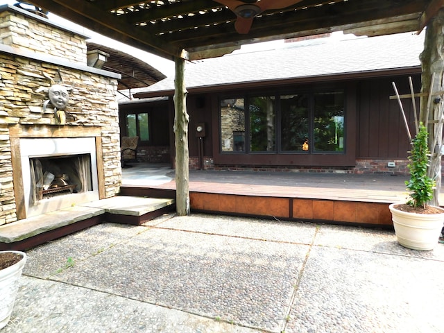 681 S County Road 150 W, Greensburg, IN 47240 - view of patio featuring an outdoor stone fireplace and a deck