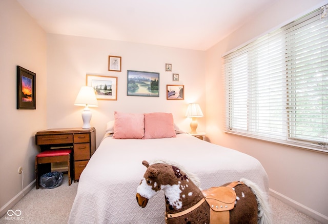 3935 Offshore Dr, Columbus, IN 47203 - carpeted bedroom featuring multiple windows and baseboards
