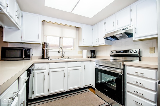 3935 Offshore Dr, Columbus, IN 47203 - kitchen featuring appliances with stainless steel finishes, a sink, under cabinet range hood, and white cabinets