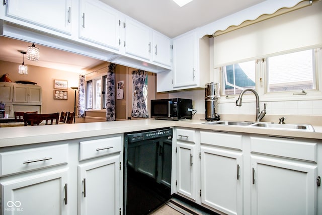 3935 Offshore Dr, Columbus, IN 47203 - kitchen with black appliances, a sink, tasteful backsplash, light countertops, and white cabinetry