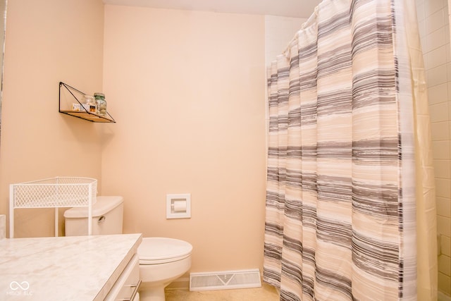 3935 Offshore Dr, Columbus, IN 47203 - full bath with vanity, toilet, tile patterned flooring, curtained shower, and baseboards