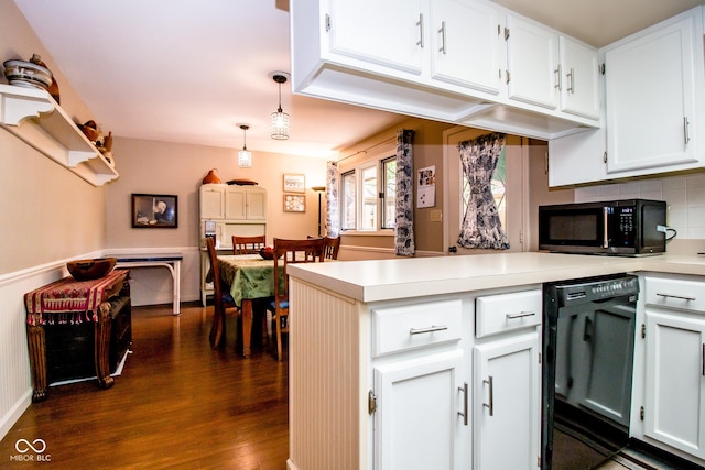3935 Offshore Dr, Columbus, IN 47203 - kitchen featuring black appliances, dark wood finished floors, a peninsula, light countertops, and decorative backsplash