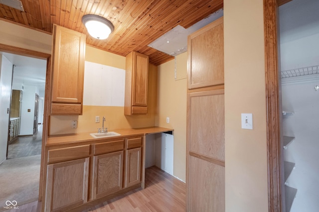 10244 Washington Blvd, Carmel, IN 46280 - kitchen featuring a sink, wooden ceiling, light countertops, light brown cabinets, and light wood finished floors