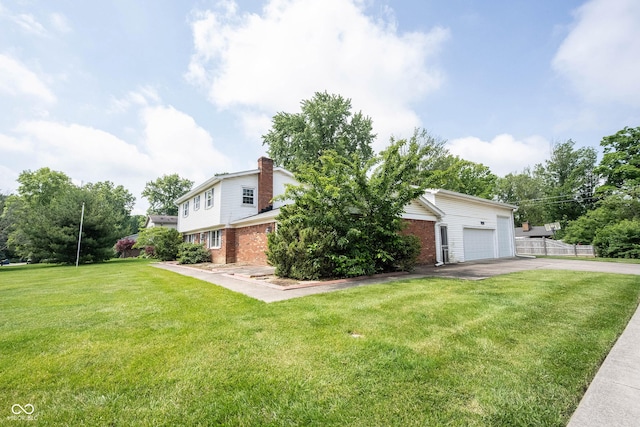 10244 Washington Blvd, Carmel, IN 46280 - view of front of property featuring driveway, brick siding, and a garage