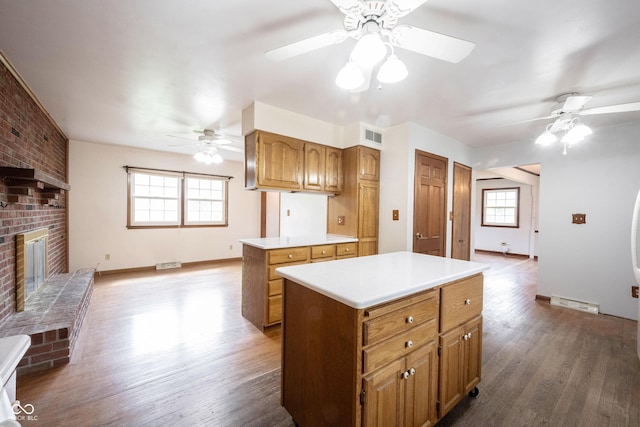 10244 Washington Blvd, Carmel, IN 46280 - kitchen featuring a ceiling fan, a kitchen island, and wood finished floors