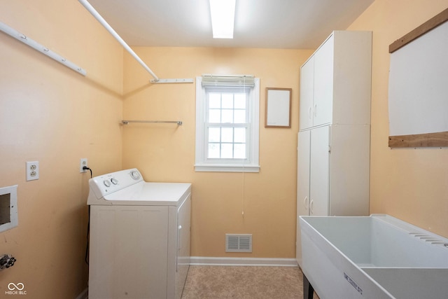 10244 Washington Blvd, Carmel, IN 46280 - washroom featuring washer / clothes dryer, cabinet space, and baseboards