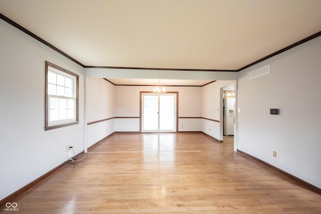 10244 Washington Blvd, Carmel, IN 46280 - unfurnished room featuring a chandelier, ornamental molding, light wood-type flooring, and baseboards