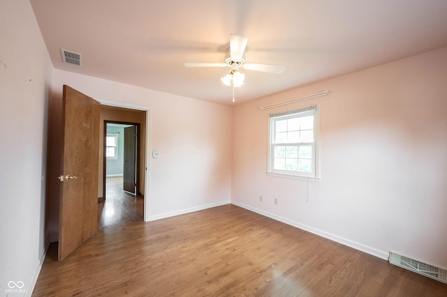 10244 Washington Blvd, Carmel, IN 46280 - empty room featuring wood finished floors, baseboards, and a ceiling fan
