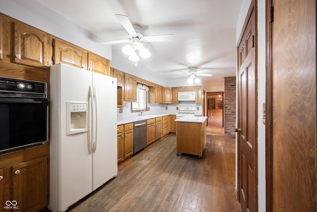 10244 Washington Blvd, Carmel, IN 46280 - kitchen featuring white appliances, a sink, ceiling fan, and light countertops