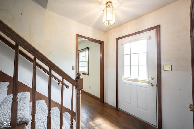 10244 Washington Blvd, Carmel, IN 46280 - foyer featuring wood finished floors, stairway, a chandelier, and baseboards