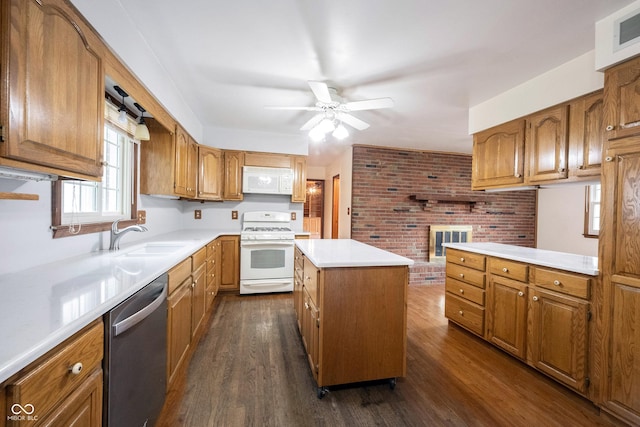 10244 Washington Blvd, Carmel, IN 46280 - kitchen with white appliances, a sink, brown cabinetry, a ceiling fan, and a center island