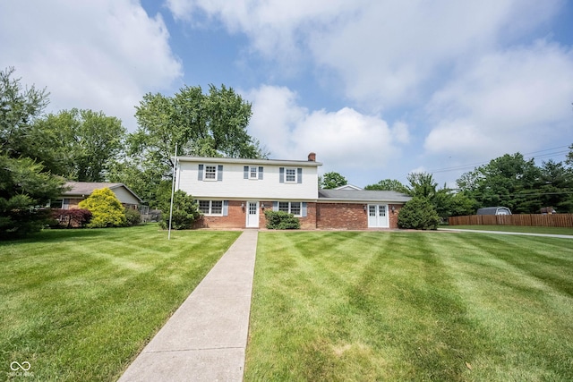 10244 Washington Blvd, Carmel, IN 46280 - colonial home featuring brick siding and a chimney
