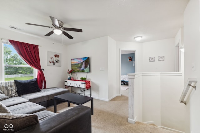 2509 Cedarmill Dr, Franklin, IN 46131 - living room featuring light colored carpet, a ceiling fan, and baseboards