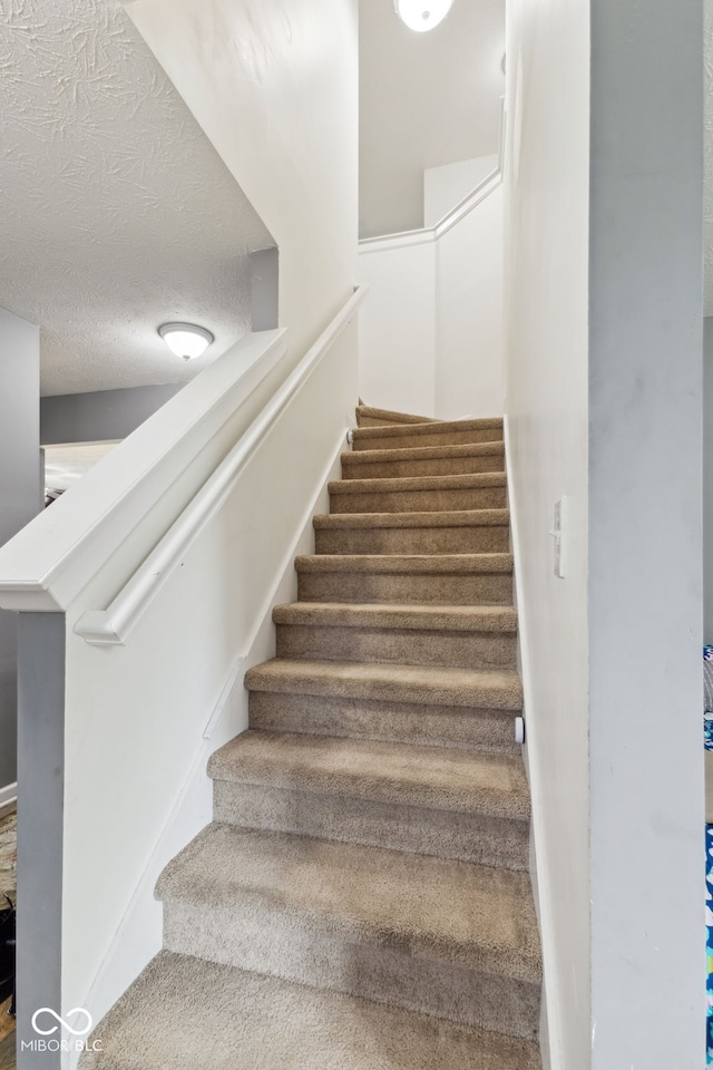 2509 Cedarmill Dr, Franklin, IN 46131 - stairway with a textured ceiling