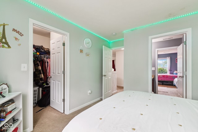 2509 Cedarmill Dr, Franklin, IN 46131 - bedroom with a spacious closet, light carpet, a closet, and baseboards