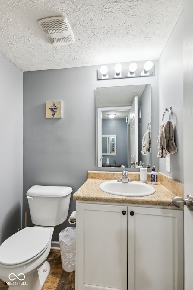 2509 Cedarmill Dr, Franklin, IN 46131 - bathroom featuring toilet, vanity, and a textured ceiling