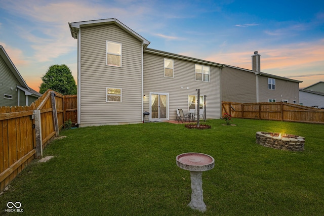 2509 Cedarmill Dr, Franklin, IN 46131 - back of house at dusk featuring a fire pit