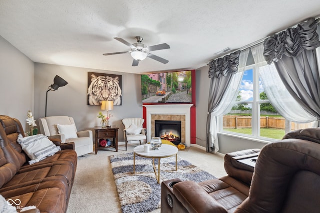 2509 Cedarmill Dr, Franklin, IN 46131 - living area with carpet floors, a ceiling fan, a fireplace, baseboards, and a textured ceiling