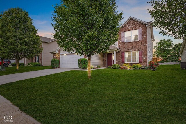 2509 Cedarmill Dr, Franklin, IN 46131 - view of front of property with driveway, brick siding, a lawn, and an attached garage