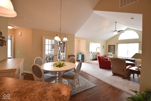 1150 Extraordinary Trl, Greenfield, IN 46140 - dining room featuring dark wood-type flooring, ceiling fan, a chandelier, baseboards, and high vaulted ceiling