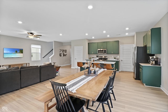 6917 Wolf Creek Ct, Whitestown, IN 46075 - dining area with light wood-type flooring, recessed lighting, a ceiling fan, baseboards, and stairway
