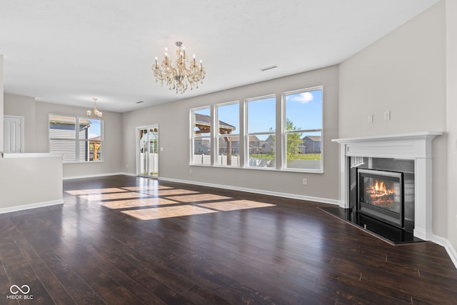 4539 Maldenhair Dr, Indianapolis, IN 46239 - unfurnished living room with a chandelier, hardwood / wood-style flooring, a fireplace with flush hearth, and baseboards
