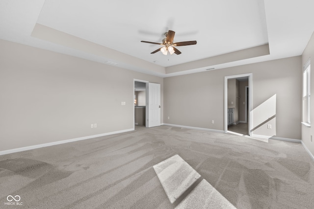 4539 Maldenhair Dr, Indianapolis, IN 46239 - unfurnished bedroom featuring a tray ceiling, carpet, and baseboards