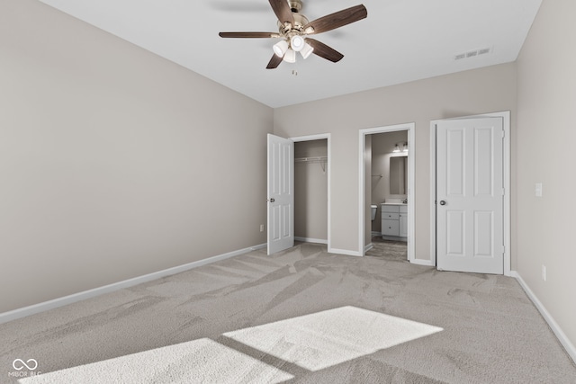 4539 Maldenhair Dr, Indianapolis, IN 46239 - unfurnished bedroom featuring light carpet, connected bathroom, baseboards, a closet, and ceiling fan