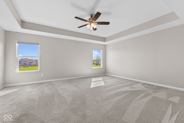 4539 Maldenhair Dr, Indianapolis, IN 46239 - carpeted empty room featuring a raised ceiling, baseboards, and ceiling fan