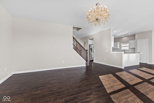 4539 Maldenhair Dr, Indianapolis, IN 46239 - unfurnished living room with dark wood-type flooring, a chandelier, baseboards, stairway, and recessed lighting