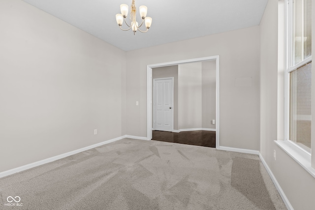 4539 Maldenhair Dr, Indianapolis, IN 46239 - carpeted empty room featuring a chandelier and baseboards
