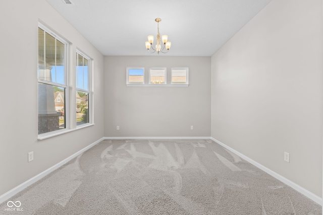 4539 Maldenhair Dr, Indianapolis, IN 46239 - carpeted empty room featuring a chandelier and baseboards