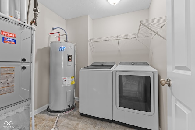 4539 Maldenhair Dr, Indianapolis, IN 46239 - laundry room featuring electric water heater, independent washer and dryer, heating unit, baseboards, and a textured ceiling