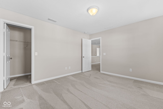 4539 Maldenhair Dr, Indianapolis, IN 46239 - unfurnished bedroom featuring baseboards, carpet, a walk in closet, and a closet