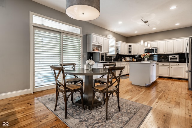 9804 Wentworth Ct, Carmel, IN 46032 - dining area featuring light wood-style floors, healthy amount of natural light, baseboards, and recessed lighting