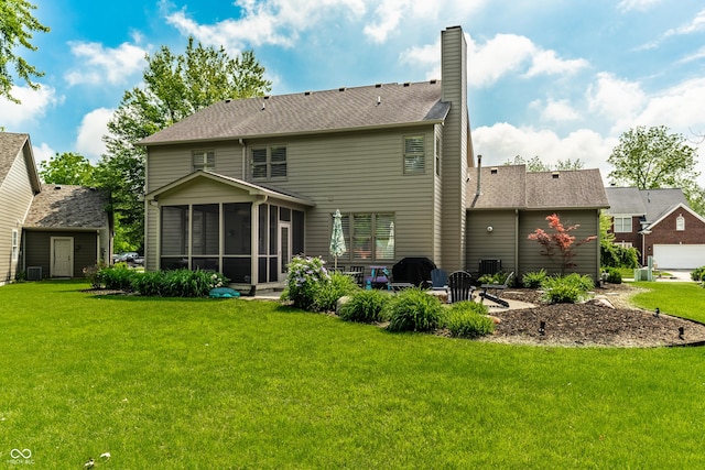 9804 Wentworth Ct, Carmel, IN 46032 - rear view of house with a sunroom, a lawn, a chimney, and a patio area