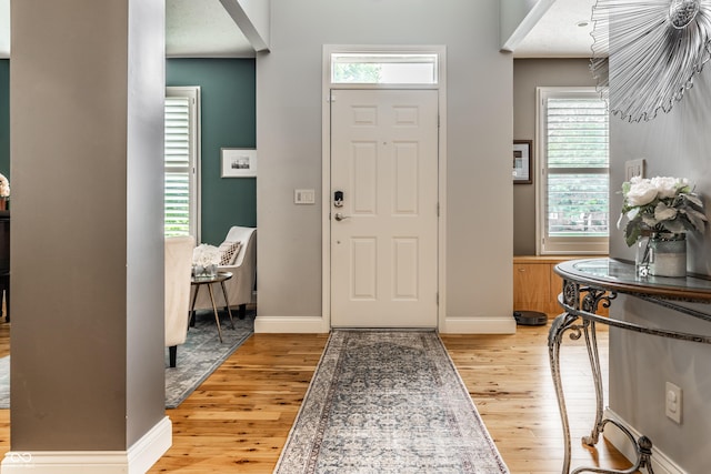 9804 Wentworth Ct, Carmel, IN 46032 - foyer with light wood-style flooring and baseboards
