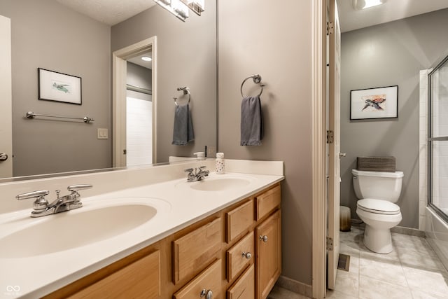 9804 Wentworth Ct, Carmel, IN 46032 - full bath with double vanity, toilet, and tile patterned floors