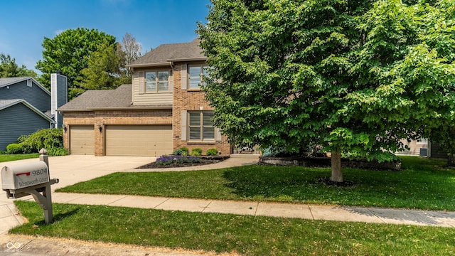 9804 Wentworth Ct, Carmel, IN 46032 - view of front facade with brick siding, driveway, a front lawn, roof with shingles, and an attached garage