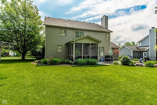 9804 Wentworth Ct, Carmel, IN 46032 - rear view of house featuring a sunroom, a patio area, and a chimney